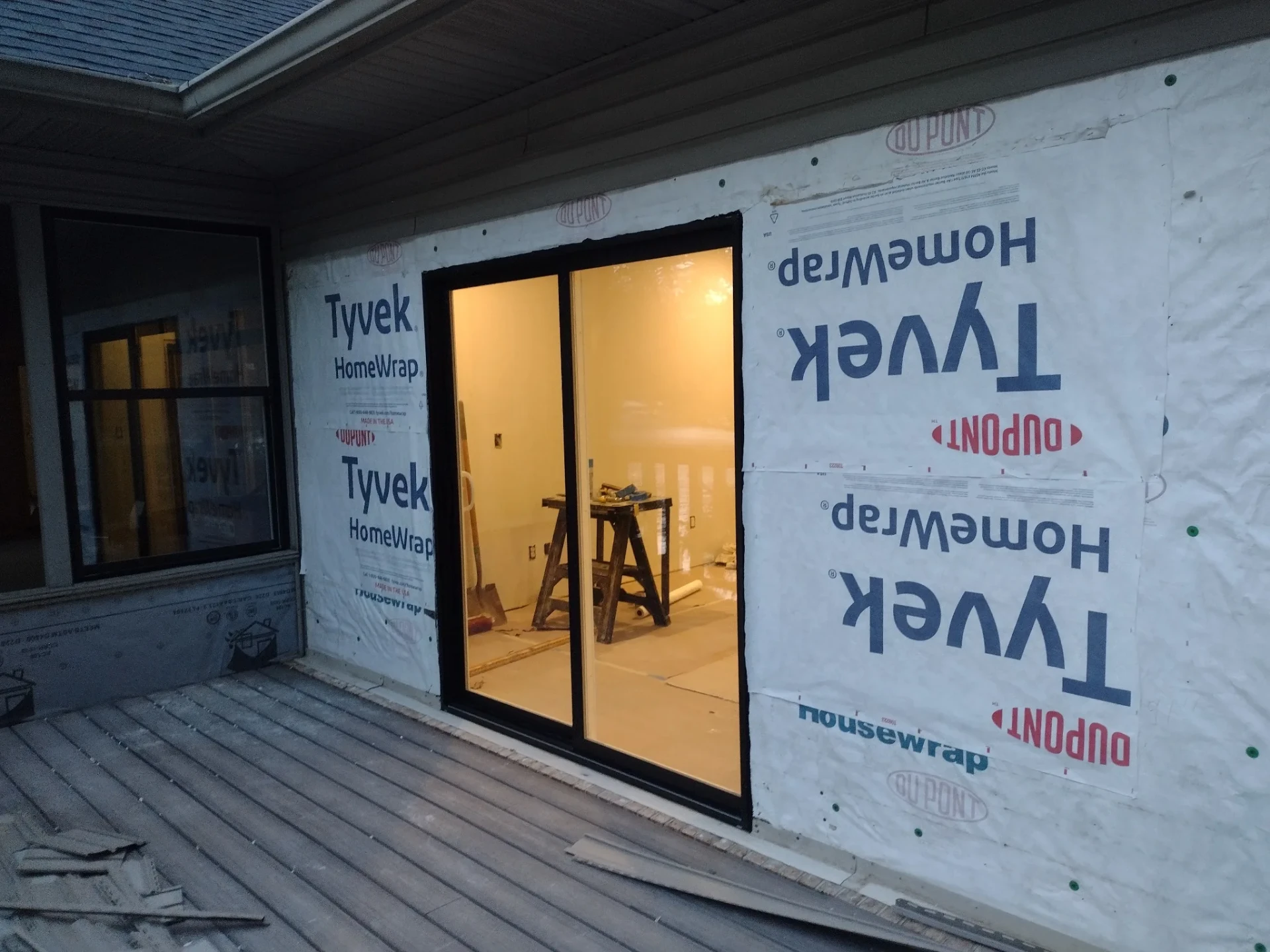Composite deck outside a newly installed sliding door, work in progress